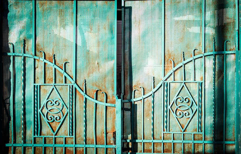 Painted steel gate panel with a scroll detail